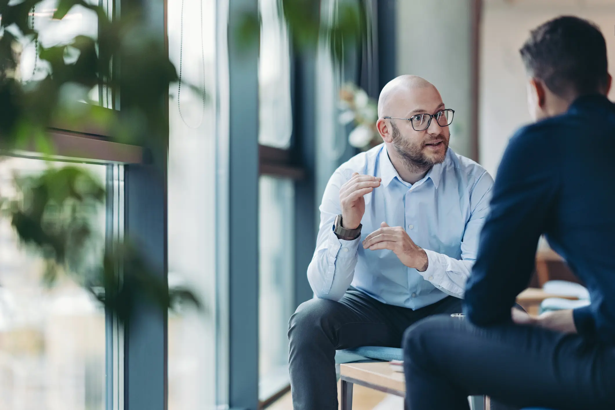 Two businessmen talking in the office
